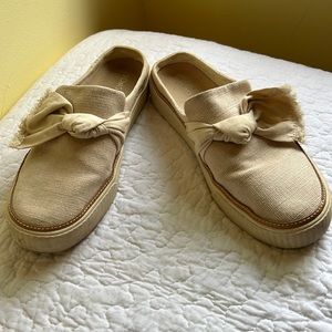 Tom’s slip on mules.